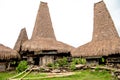 Kodi, Sumba Island, Nusa Tenggara, typical houses with tall roofs. Royalty Free Stock Photo